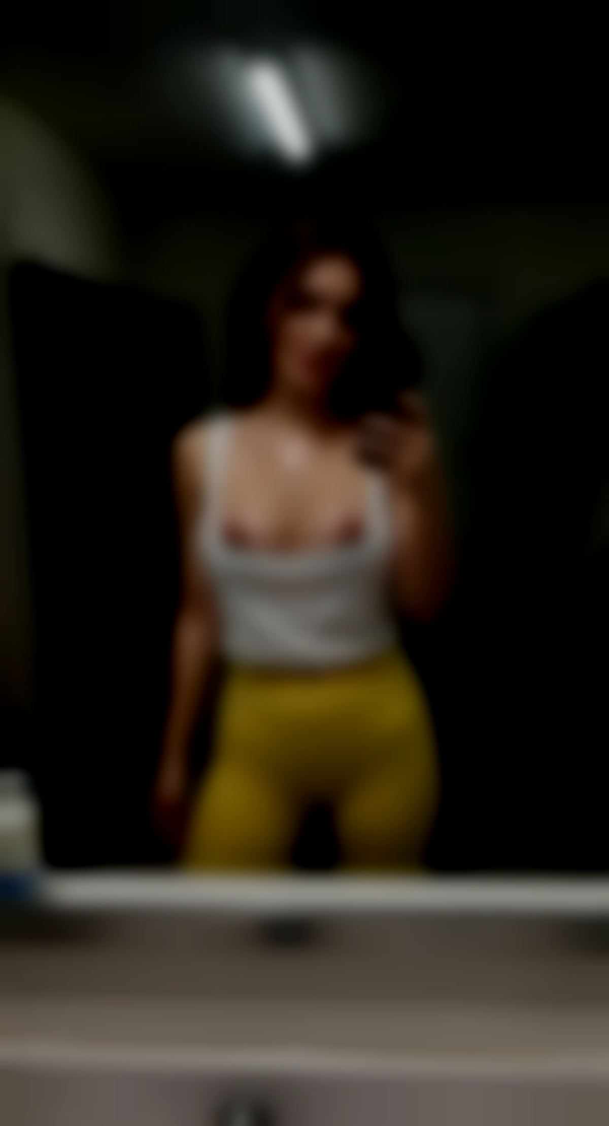 Edit the reference image: Amateur Snapchat-style mirror selfie taken with an iPhone in a casual gym locker room, POV front-facing camera an…